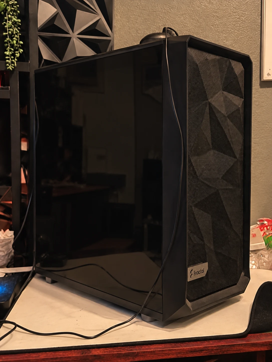 Shayde's black Fractal PC at his home desk, retouched to balance the original red lighting
