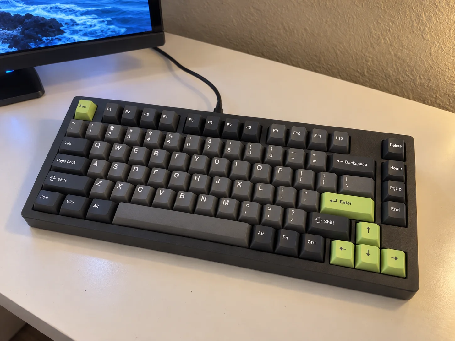 Keyboard design concept with charcoal keycaps and green accents, not a completed build